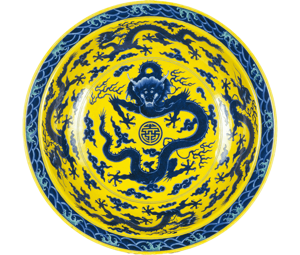 Jingdezhen ware. Dish with design of dragons and clouds, underglaze blue and overglaze yellow, partly colored with green enamel. Qing dynasty, Qianlong(1736～95) period.